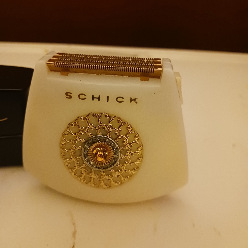 Schick White and Gold Electric Shaver
